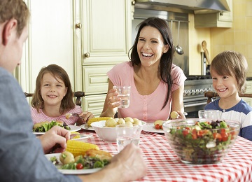 A father, a mother, a son and a daughter having a family meal.
